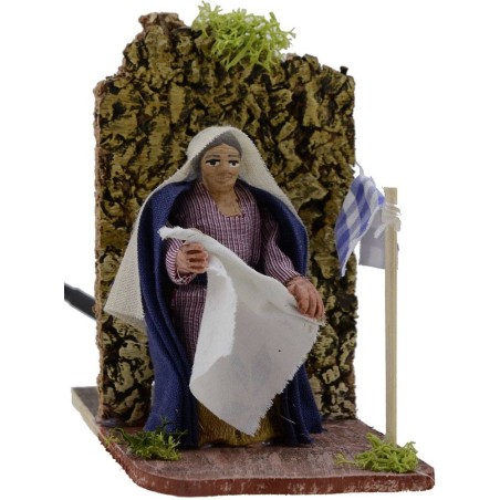 Woman 8 cm in motion hangs the clothes