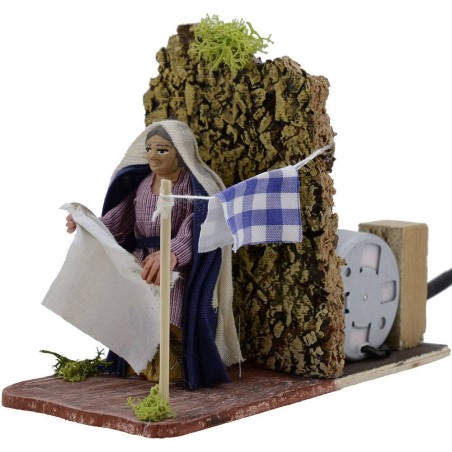 Woman 8 cm in motion hangs the clothes