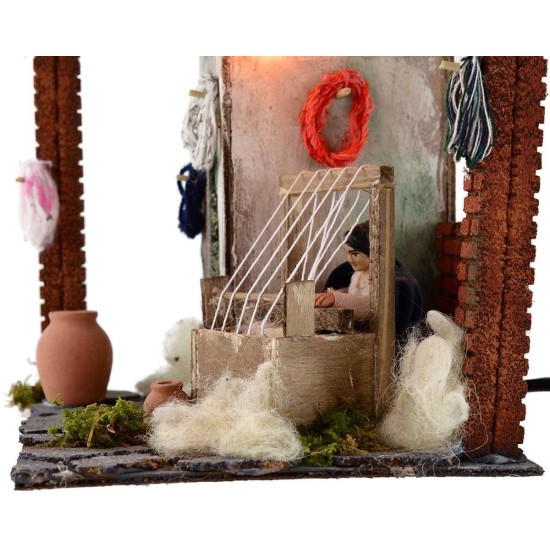 Tejedora de 10 cm en movimiento con luz, 20x18x20 cm de altura. Mundo