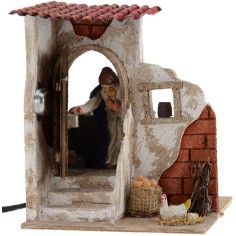 Donna 10 cm che apre la porta 15x15x18 h. Mondo Presepi