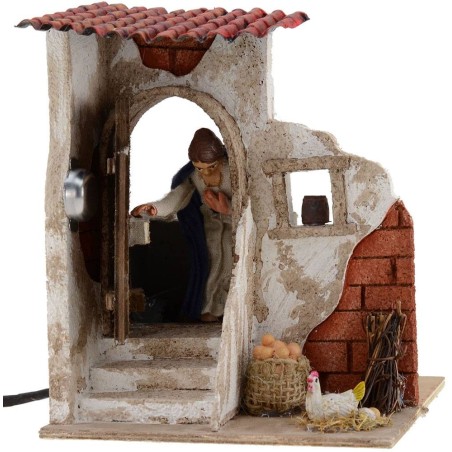 Mujer de 10 cm que abre la puerta 15x15x18 h. Mundo Belenes.