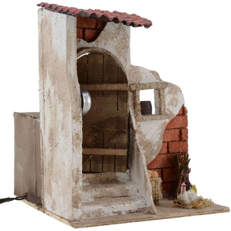 Mujer de 10 cm que abre la puerta 15x15x18 h. Mundo Belenes.