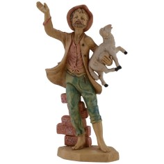 Hombre sentado en el muro con cordero en brazos serie lux cm 16