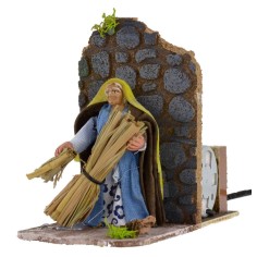 Oriental farmer with bundles of straw 8 cm series in motion