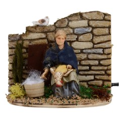 Donna che spenna in movimento serie 10 cm Landi Mondo Presepi