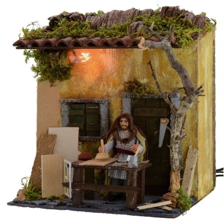 Carpintero en movimiento de 10 cm con casa iluminada Mondo Presepi