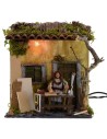 Carpintero en movimiento de 10 cm con casa iluminada Mondo Presepi