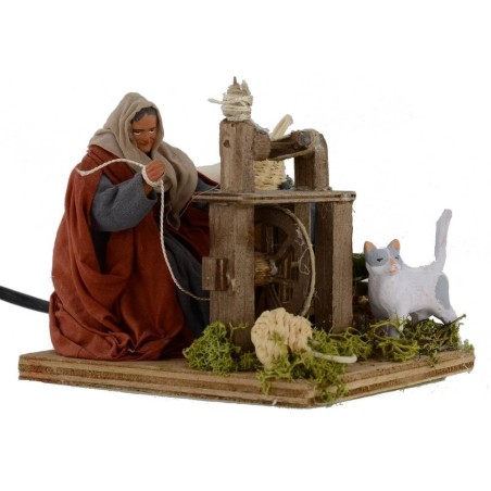 Donna all'arcolaio che fila la lana in movimento serie 12 cm