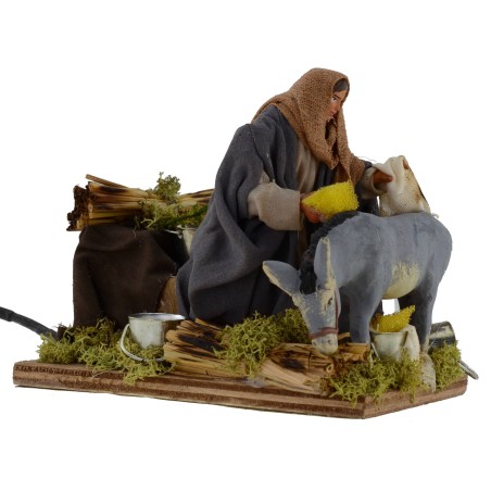 Hombre que cepilla burro en movimiento serie 12 cm Mundo Pesebres