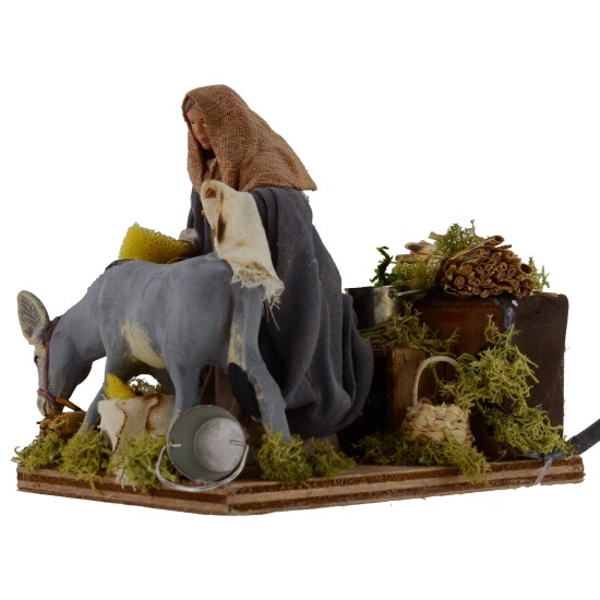 Uomo che striglia asino in movimento serie 12 cm Mondo Presepi