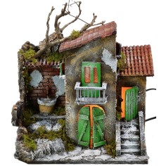 Casa iluminada con fuente funcionando de 30x21x35 cm h