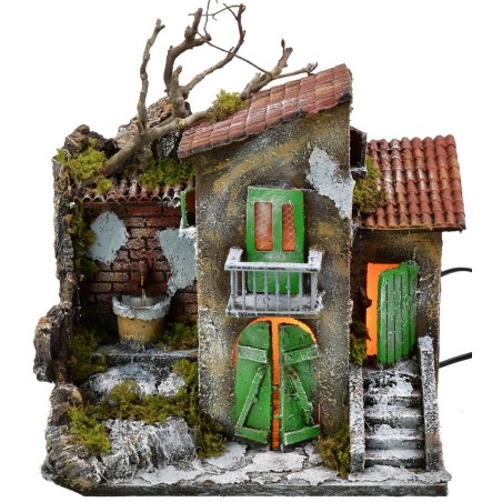 Casa iluminada con fuente funcionando de 30x21x35 cm h