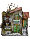 Casa iluminada con fuente funcionando de 30x21x35 cm h