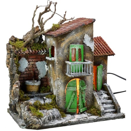 Casa iluminada con fuente funcionando de 30x21x35 cm h