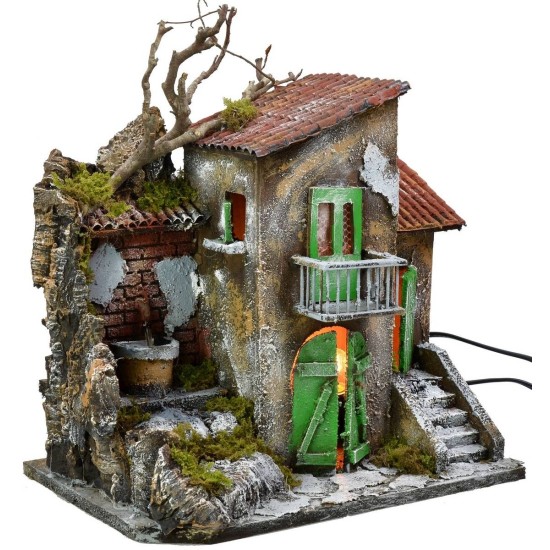 Casa iluminada con fuente funcionando de 30x21x35 cm h