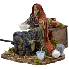 Man grooming donkey in motion 12 cm 2