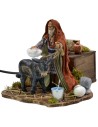 Man grooming donkey in motion 12 cm