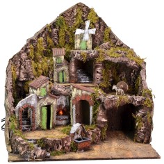 Illuminated nativity scene with functioning fountain, fire and