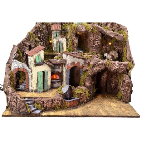 Illuminated nativity scene with functioning fountain, fire and