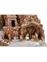 Illuminated nativity scene complete with Landi statues with fountain