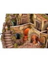 Illuminated nativity scene complete with Landi statues and waterfall