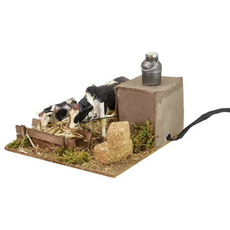 Vacas en movimiento en el pesebre cm 15x15,5x10 h Mundo