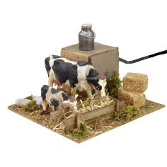 Vacas en movimiento en el pesebre cm 15x15,5x10 h Mundo