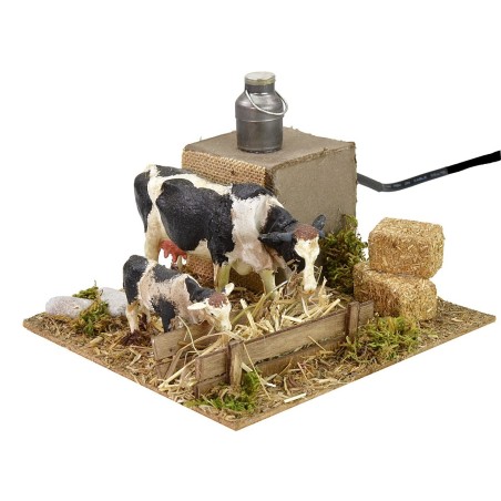 Vacas en movimiento en el pesebre cm 15x15,5x10 h Mundo