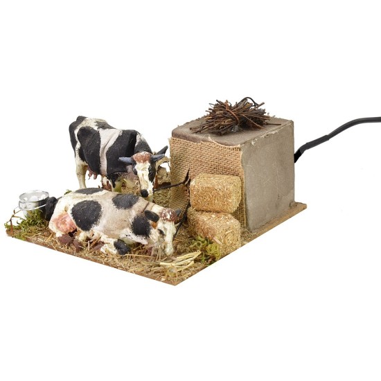 Mucche in movimento che mangiano cm 15x15x7 h Mondo Presepi