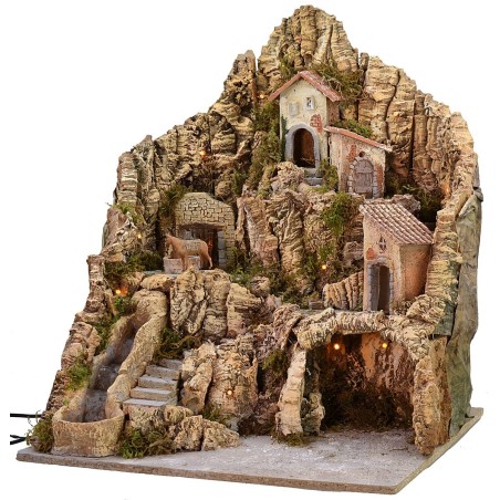 Illuminated nativity scene with functioning waterfall and donkey at the millstone