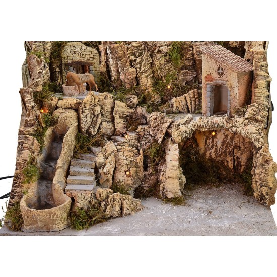 Illuminated nativity scene with working waterfall and donkey at the millstone