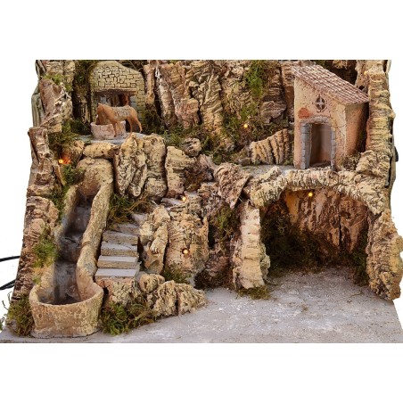 Presepe illuminato con cascata funzionante e asino alla macina