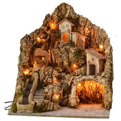 Illuminated nativity scene with functioning waterfall and donkey at the millstone