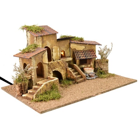 Grupo de casas con pozo iluminadas por corriente de 47x32x24,5