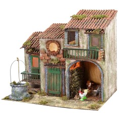 Cascina di campagna illuminata a corrente con animali e pozzo