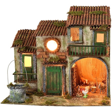 Casa de campo iluminada con electricidad con animales y pozo.