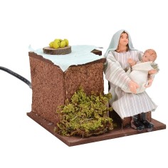 Mujer árabe serie 12 cm que arrulla al bebé en movimiento.
