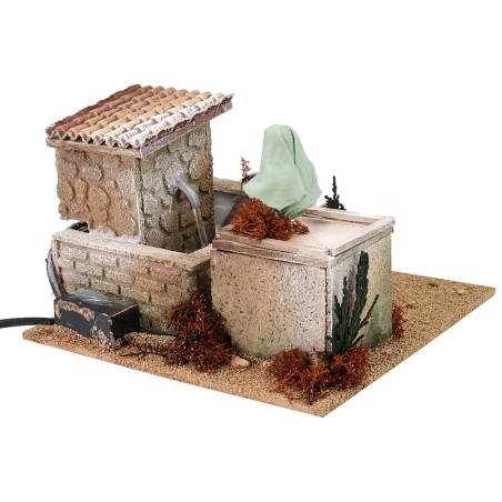 Donna alla fontana 12 cm in movimento cm 20x20x13,5 h Mondo