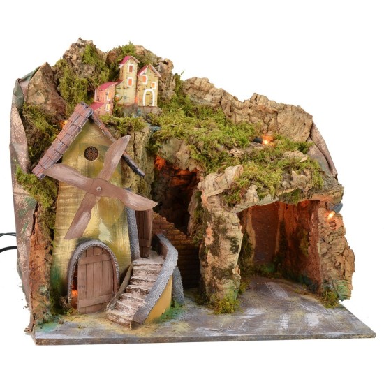 Paisaje iluminado con cueva y molino en funcionamiento a corriente