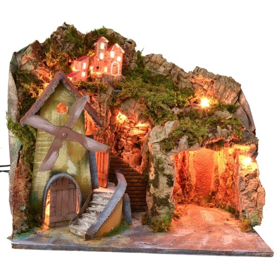 Paisaje iluminado con cueva y molino funcionando a corriente de