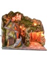 Paisaje iluminado con cueva y molino funcionando a corriente de