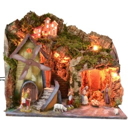 Illuminated nativity scene with cave and working electric mill