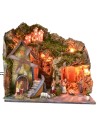 Classic illuminated nativity scene with grotto and mill running