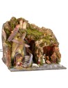 Classic illuminated nativity scene with grotto and mill running