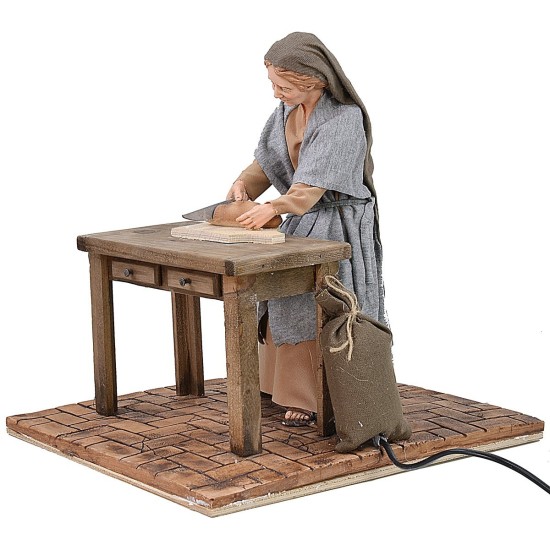 Mujer oriental que corta el pan en movimiento 30 cm Mundo