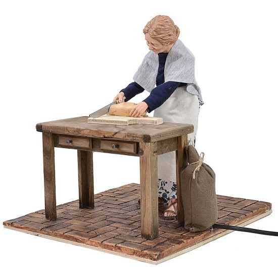 Mujer popular que corta pan en movimiento 30 cm Mundo.