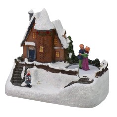 Snowy house scenario with battery-operated skating rink 2