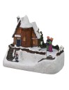 Snow-covered house scenery with functioning ice rink a