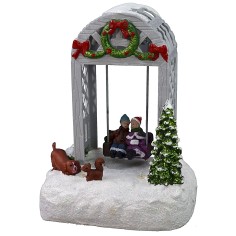 Escenario navideño con niños en el columpio funcionando a 2