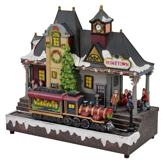 Escenario navideño de estación de tren a pilas.